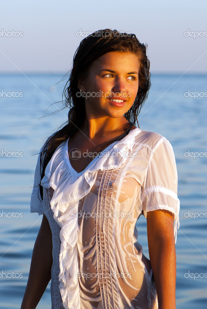 Beautiful Girl In A White Wet Transparent Dress Costs Sea - Stock.